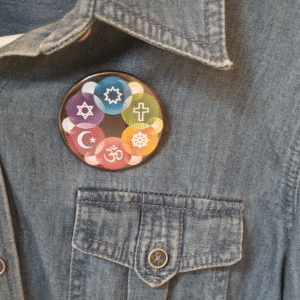 Interfaith Design Button on shirt