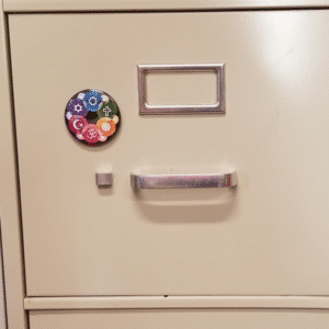 Interfaith Design Magnet on cabinet
