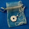 Kid's Interfaith Pendant comes in an organza pouch