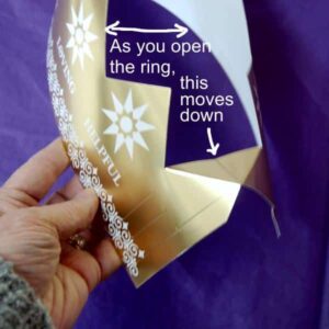 As you open the crown into a ring, the tab stays down