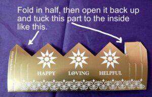 Fold in half, unfold, tuck tab down and fold in half again