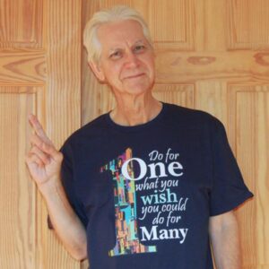 This is me, modeling the "Do for ONE what you wish you could do for many" - T-shirt in Black